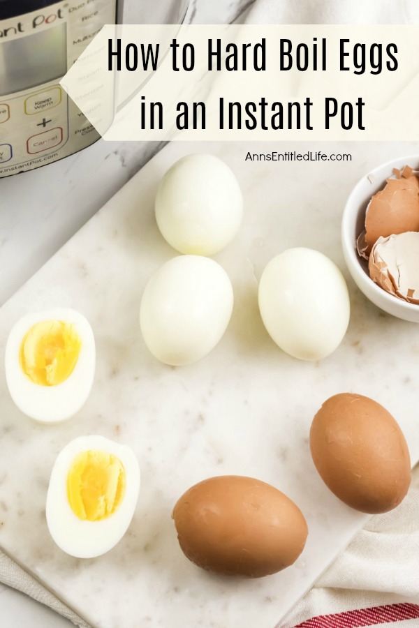 4 peeled hard-boiled eggs, one cut in half, 2 brown hard boiled eggs, instant pot in background, bowl of egg shells on the right
