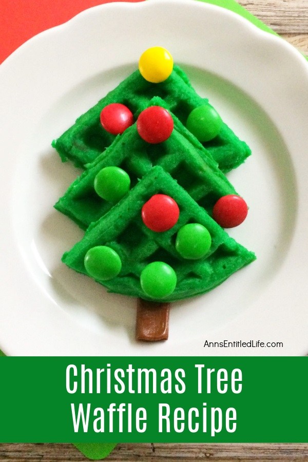  Green colored waffle in the shape of a Christmas tree on a white plate