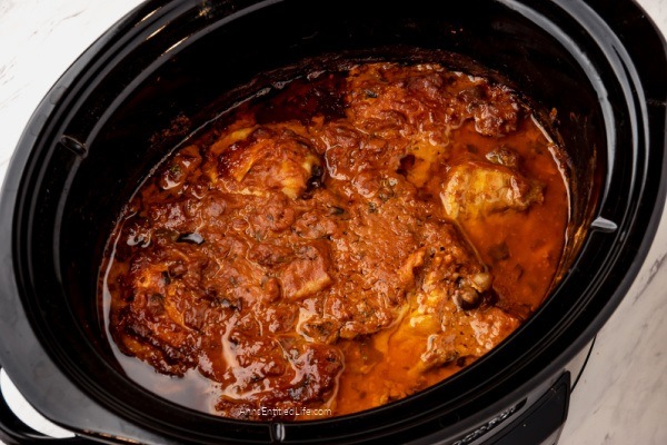 Slow Cooker Spicy Chicken Thighs Recipe. This slow-cooker spicy chicken thighs recipe is easy to prepare, has a bit of a bite with many interesting flavors. The chicken thighs are tender and juicy when done.