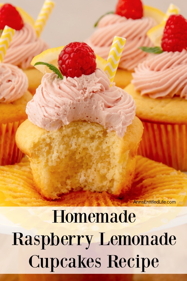 side view of 5 homemade raspberry lemonade cupcake on a white plate, the front cupcake has a bite missing