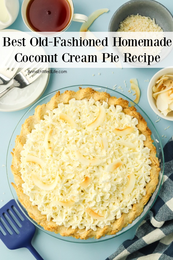 Whole coconut cream pie - there are white plates and a cup of coffee in the upper left, coconut in a white bowl in the upper right. 