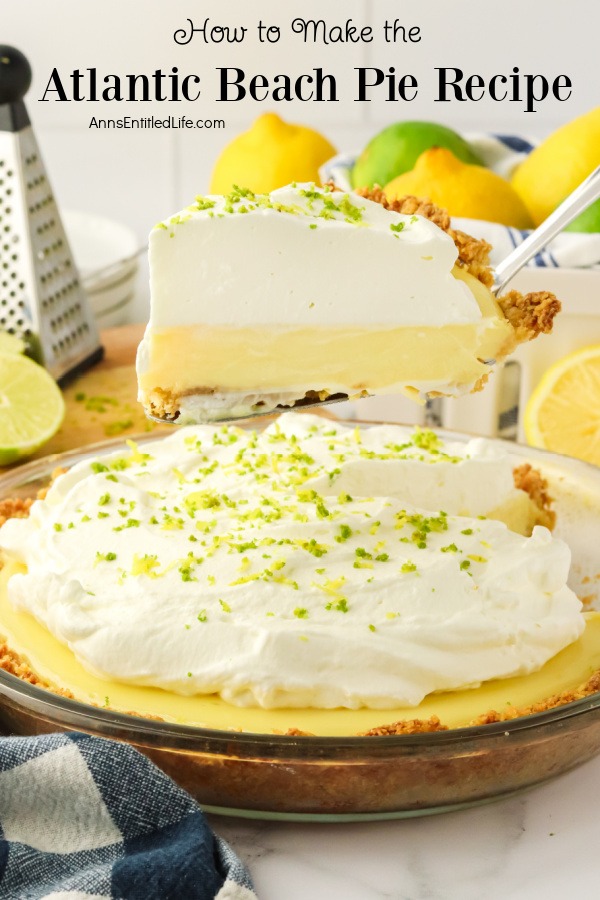 A piece of Atlantic Beach pie is being lifted from the pie plate below. There are lemons and limes in the upper right, a grater in the upper left.