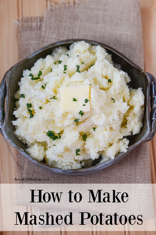 Overhead view of a black bowl filled with mashed potatoes.