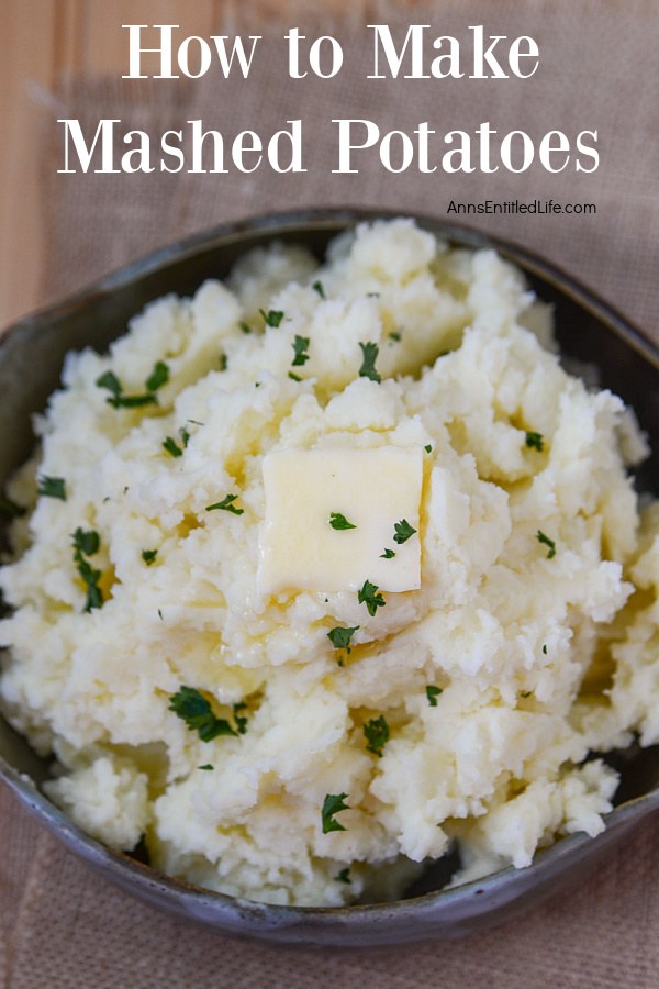 Close up overhead view of a black bowl filled with mashed potatoes.