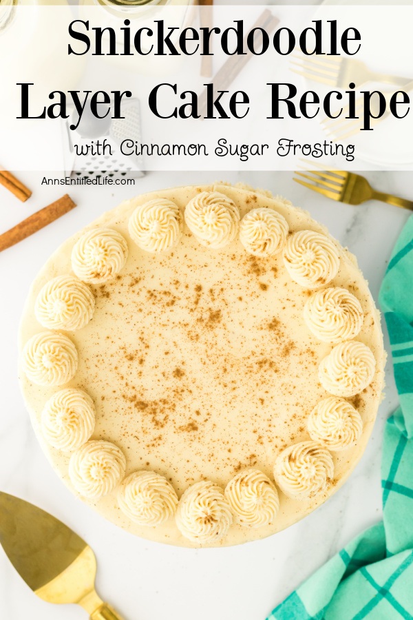 An overhead view of a whole Snickerdoodle cake that is frosted with cinnamon buttercream frosting.