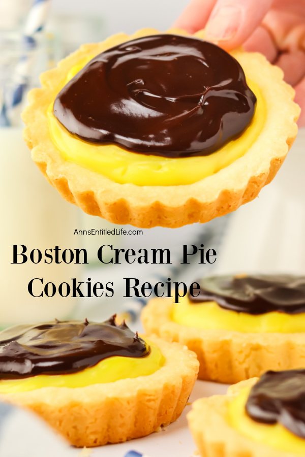 a Boston cream pie cookie is being lifted in the air, there are three cookies on the counter below.