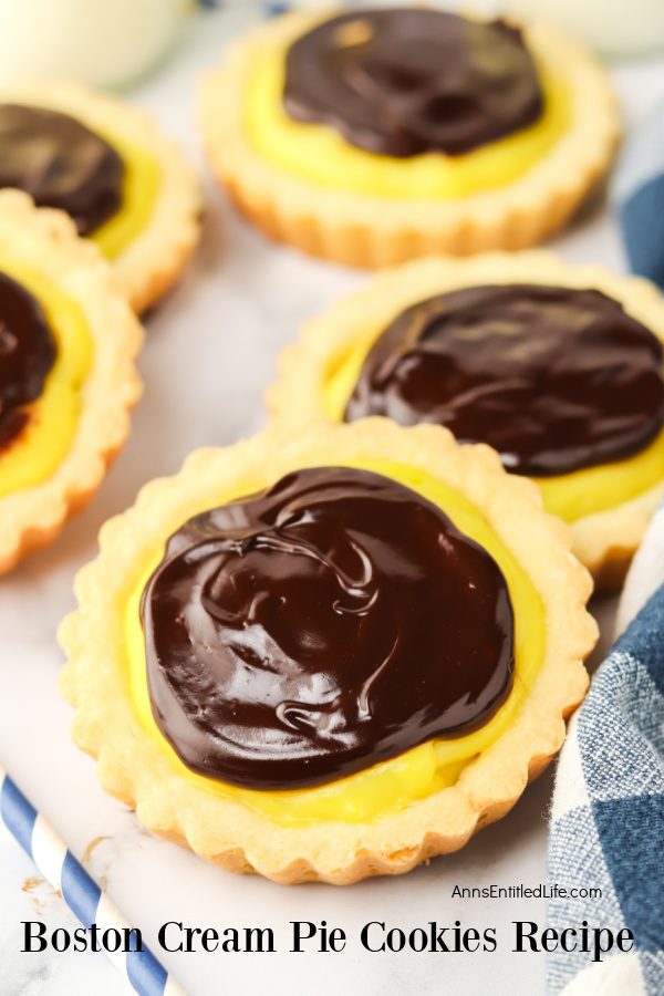 Close-up of five Boston cream pie cookies on white counter.