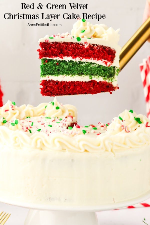 A piece of red and green velvet Christmas cake is being lifted with a cake lifer from the cake below