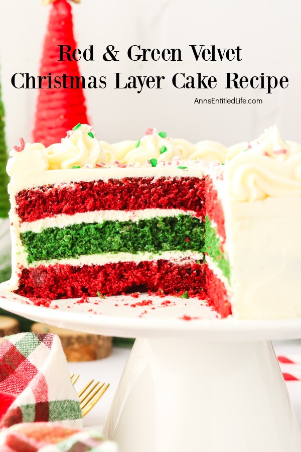 An open view into the cut cake of red and green velvet Christmas cake on a white cake stand