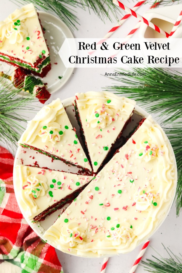 Overhead view of a red and green velvet Christmas cake, half is whole, the other half is cut. There is a piece on a white plate in the upper left