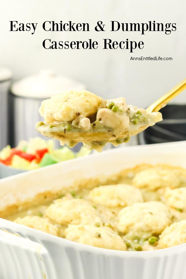 A spoonful of chicken and dumplings is being lifted from the white casserole dish below.